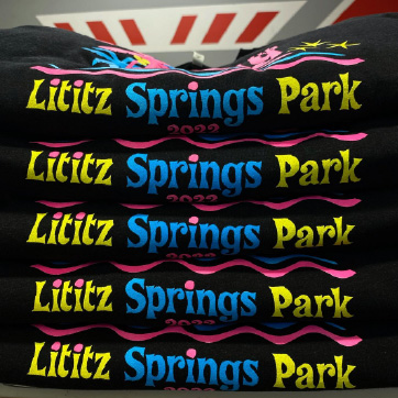 Stack of Litiz Springs Park t-shirts